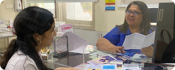 Trishha discussing research with Dr. Meenakshi Ahuja